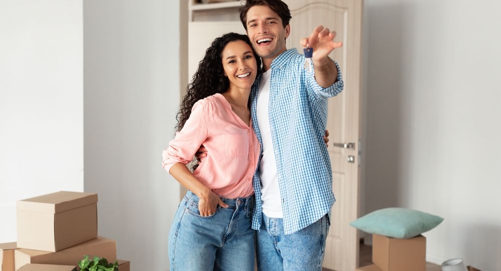 House,Ownership.,Portrait,Of,Happy,Young,Couple,Holding,Showing,Key